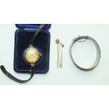 A 1960's silver hinged bangle, a gold-cased wrist watch, (a/f), a gold bar brooch and a stick pin