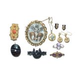 A 19th century gilt metal brooch set coral, a banded pendant, a gilt metal swivel brooch and other