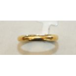 A 22ct gold wedding band, size N½, 2.5g.