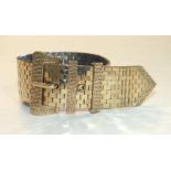 A 9ct gold brick-link wide bracelet in the form of a belt and buckle, with textured buckle and two
