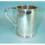 A plain cylindrical tankard, 12cm high, London 1939, ___11oz.