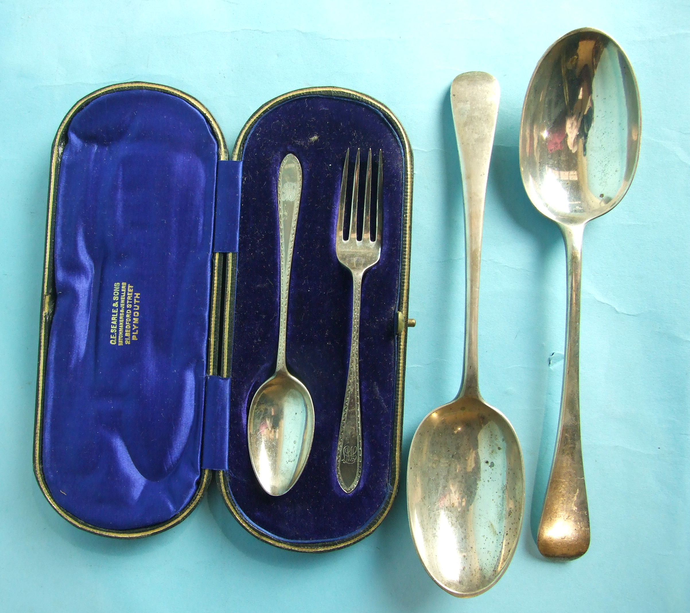 A bright-cut christening spoon and fork in fitted case, Sheffield 1909 and a pair of modern Old