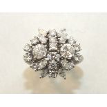 A diamond cluster ring claw-set twenty-four brilliant and marquise-cut diamonds, in 18ct gold