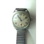 A vintage Tudor cushion-cased wrist watch, the silvered dial with Arabic and baton numerals and