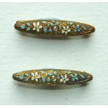 A pair of small 14k gold brooches, each set a seed pearl within enamelled floral decoration, 24mm