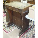 *A school master's vintage pine desk, the hinged sloping desk top and inkwell aperture with metal