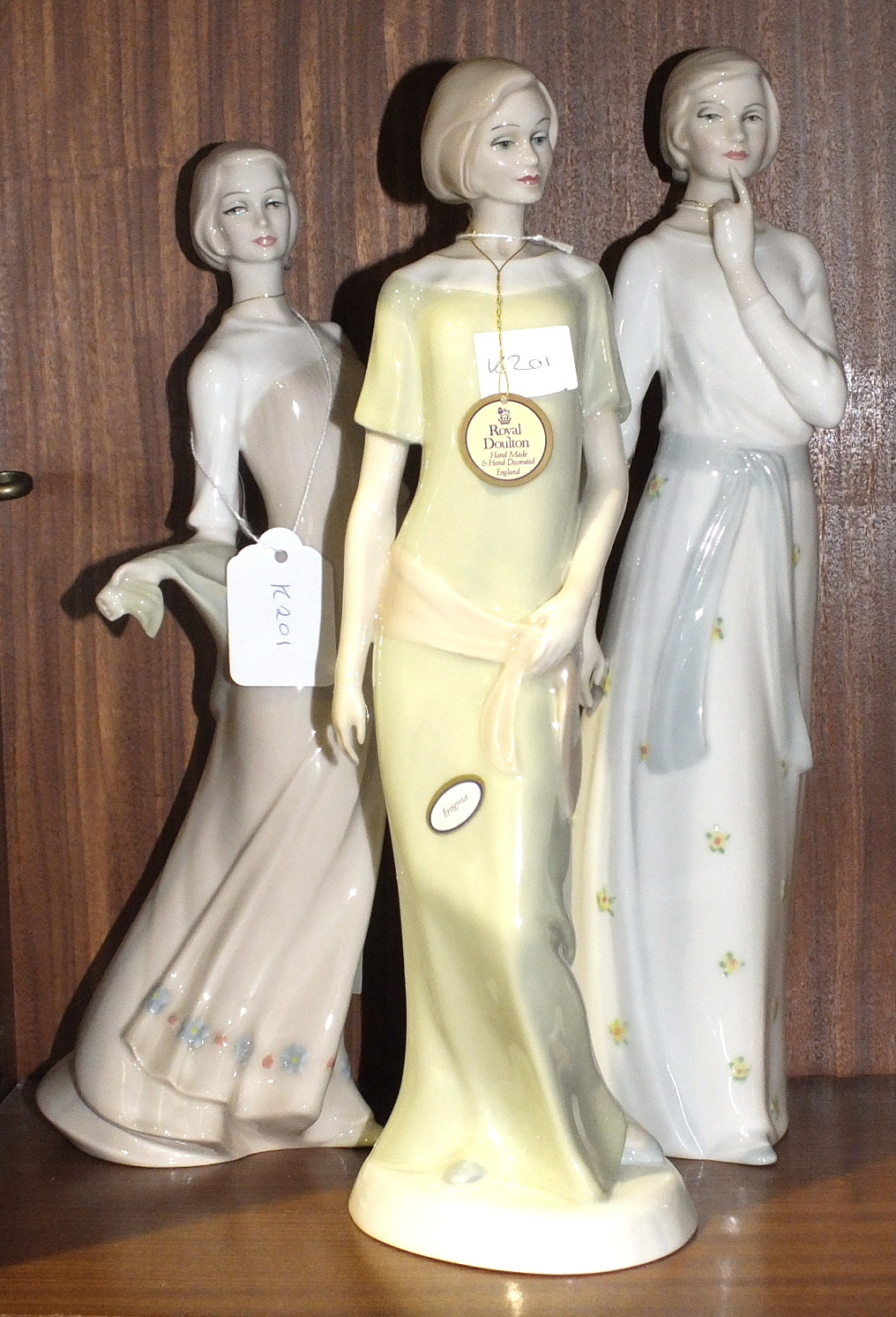 Three Royal Doulton figurines from the Reflections Series, "Pensive" HN3109, "Enchanting Evening"