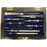 A set of drawing instruments in fitted rosewood box, with inscription "J W Skinner, Presented by