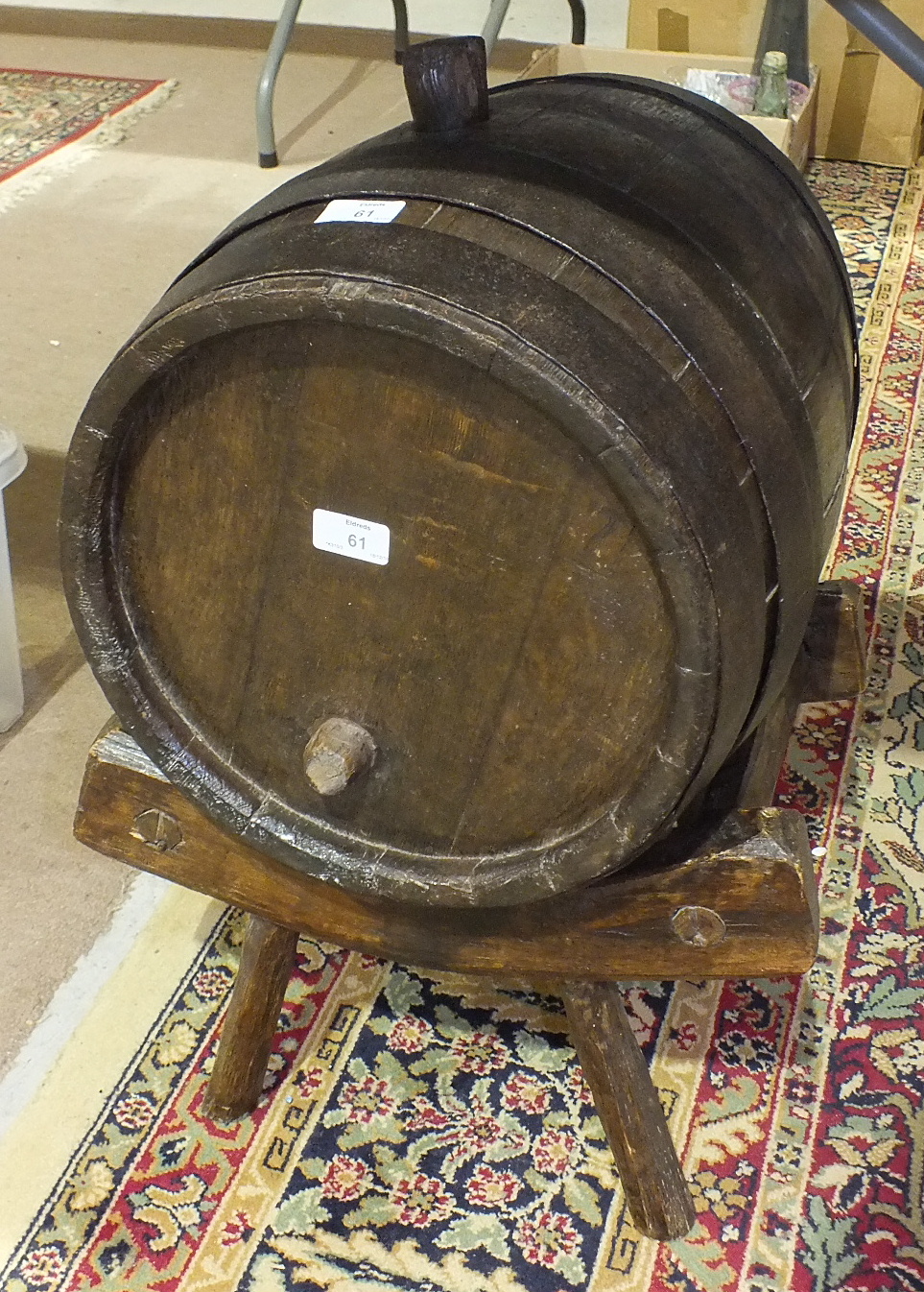 A metal-bound oak cider barrel, on cradle stand, barrel 32cm diameter, 38cm high.