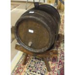 A metal-bound oak cider barrel, on cradle stand, barrel 32cm diameter, 38cm high.