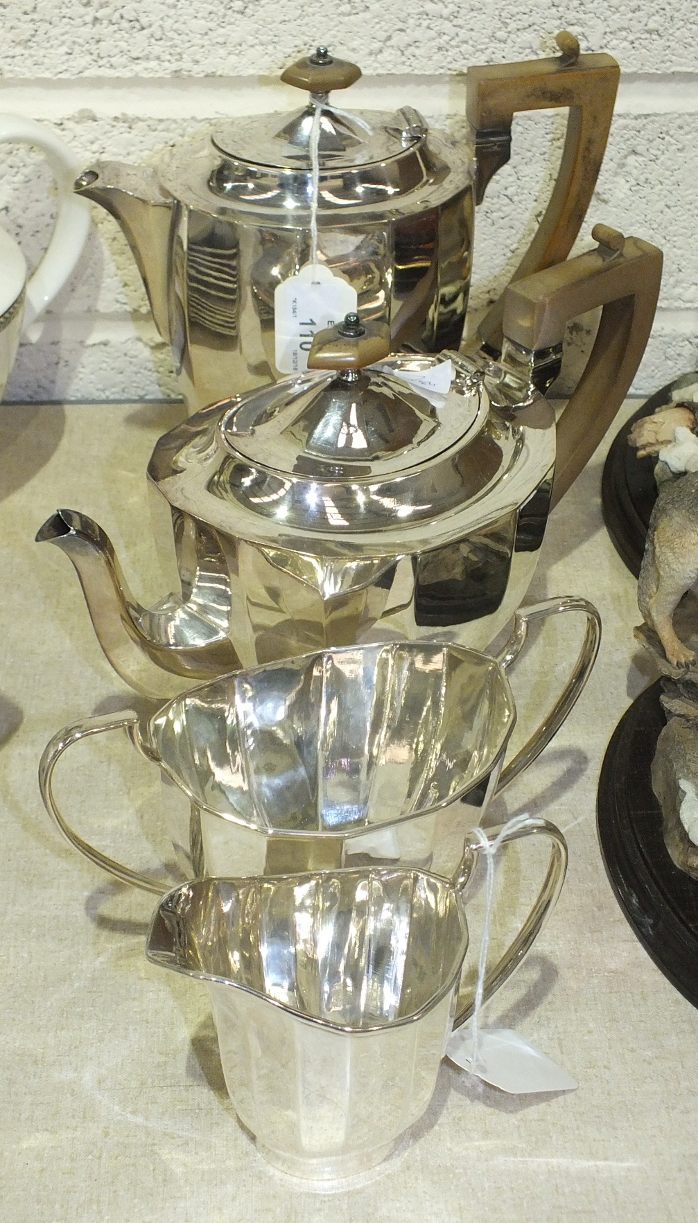 A plated four-piece tea service of 14-sided ovoid shape, (4).