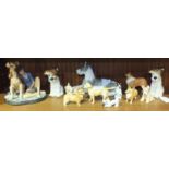 A Royal Doulton figure "Buddies" HN2546 and eleven various ceramic dog figures, including SylvaC,