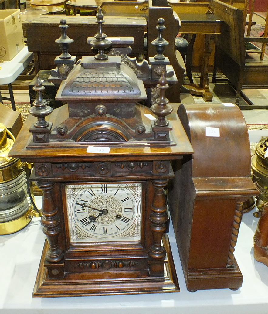 A walnut-cased striking mantel clock of architectural form, the movement marked "Junghans", 55cm