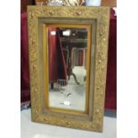 A gilt rectangular-framed wall mirror with etched urn decoration, 85 x 53cm.