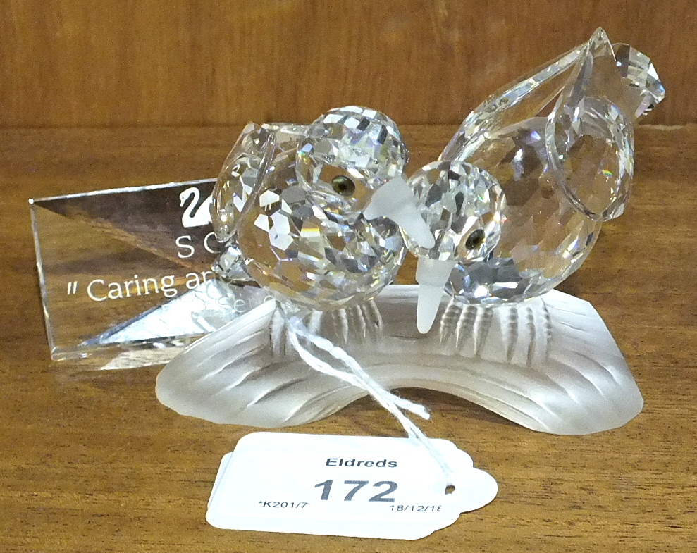 A Swarovski Collectors Society crystal glass figure "Turtle Doves", together with "Caring and