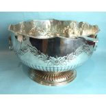 A large plated half-fluted Monteith with gadrooned rim, lion mask ring handles and chased with