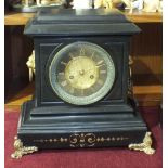 A black slate striking mantel clock by Roblin & Sons, Paris, with gilt metal lion masks, rings and