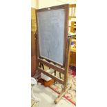 *A Victorian pitch pine schoolroom blackboard of rectangular shape, the rectangular board on cast