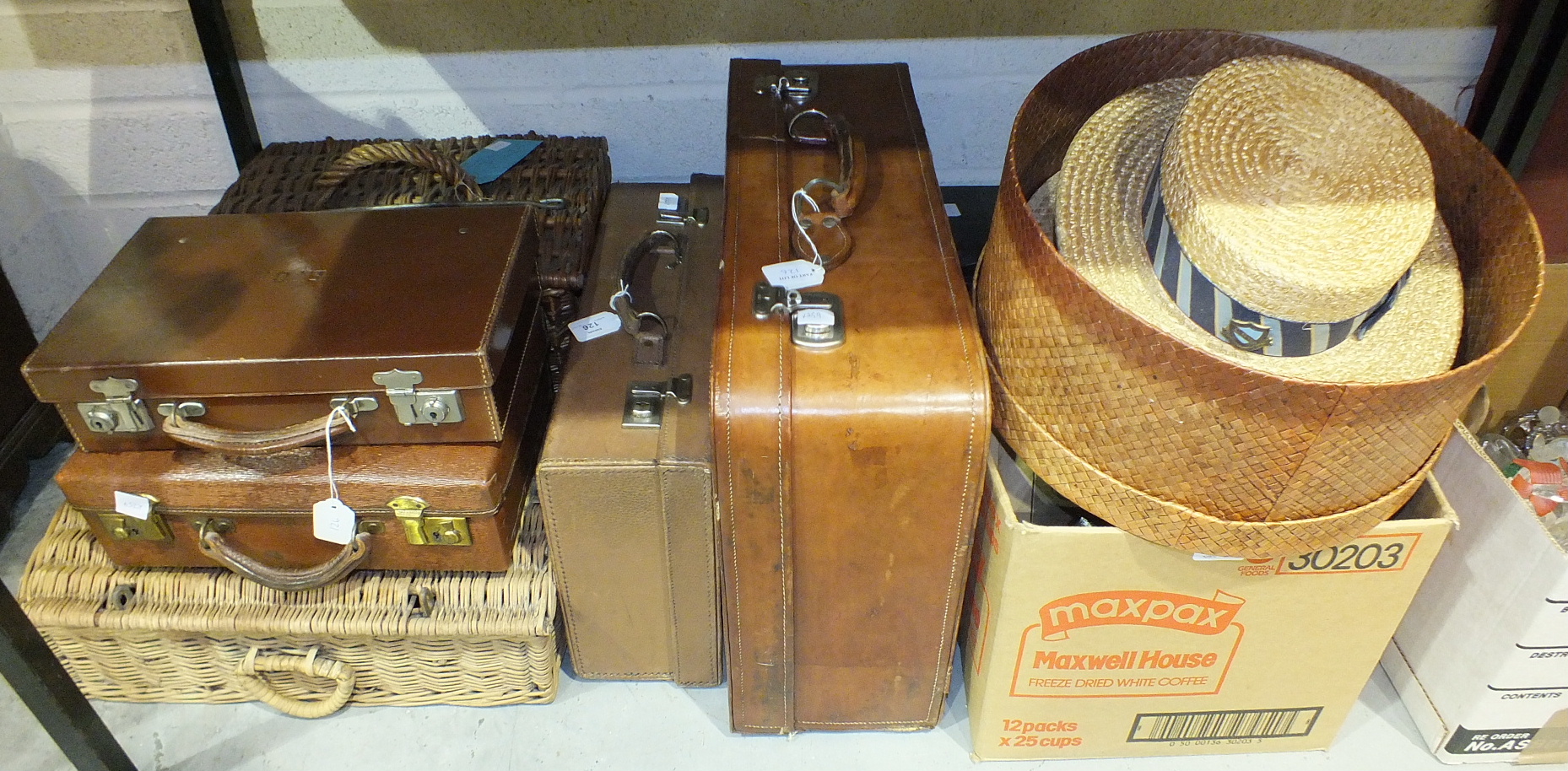 Two Ridgmont straw boaters, various suitcases and other miscellaneous items.