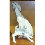 A Lladro figure of a seated Afghan Hound, 29.5cm high and a calf-standing, 13cm high, (2).