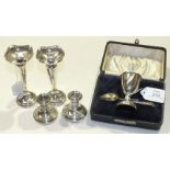 A cased silver egg cup and spoon, Birmingham 1922, a pair of silver loaded-base spill vases, 12.