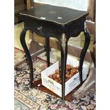 A Continental metal-mounted ebonised work table, (damages to legs), a modern magazine stand, a