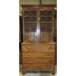 A Georgian mahogany secretaire/bookcase, the upper part having two small cupboard doors and