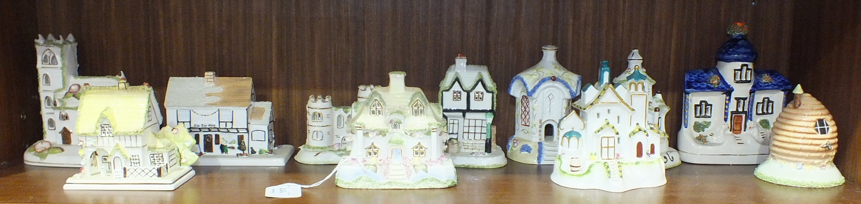 A collection of eighteen Coalport bone china cottage models and four others, (22).