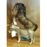 A Beswick model of a Welsh Cob (rearing), no.1014, (second version), brown gloss, 26cm and a donkey,