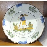 A French Faience dish commemorating 'The French Revolution 1792', 23cm diameter.