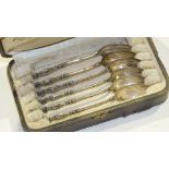 A cased set of six French silver teaspoons, each with crown and coat of arms finial and inscribed "