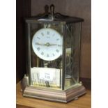 A Kunde 400-day clock under hexagonal glass and metal case, 25cm high.