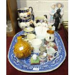 A large blue and willow pattern meat plate, 53 x 43cm, a coloured bisque figure group of a young boy