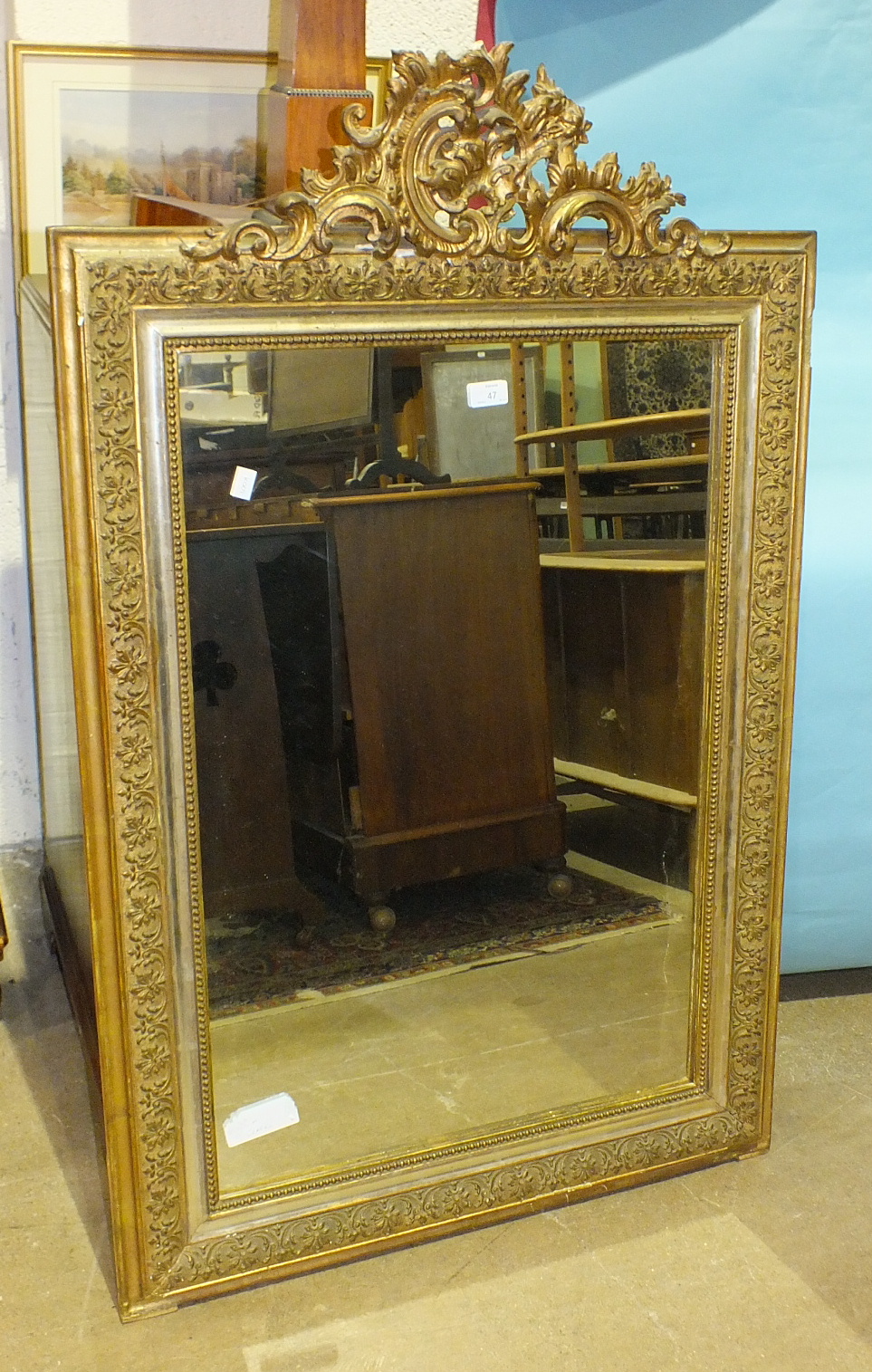 A 19th century gilt gesso rectangular wall mirror with carved crest and leaf-decorated border, 120 x