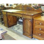 A George IV mahogany pedestal sideboard, the carved scrolling low back above three frieze drawers