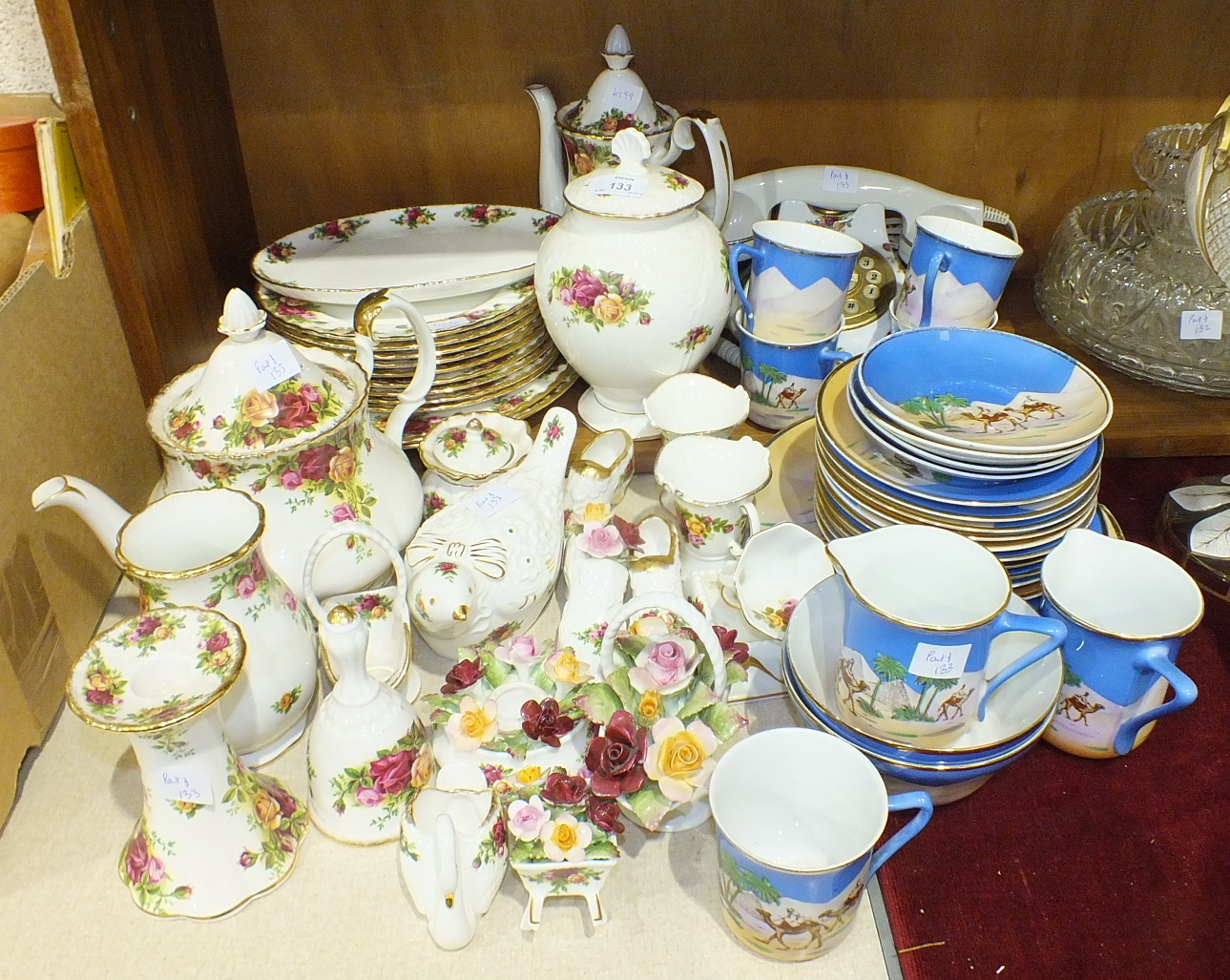 A collection of Royal Albert 'Old Country Roses' tea and dinner ware, flower-encrusted ornaments,