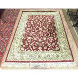 A Laura Ashley pink and cream cotton rug, 235 x 155cm and a modern Beluchi cream and red Belgian