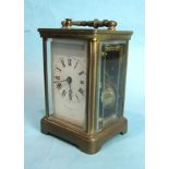 A 19th century French brass repeating carriage clock striking on a gong, enamel dial damaged, marked