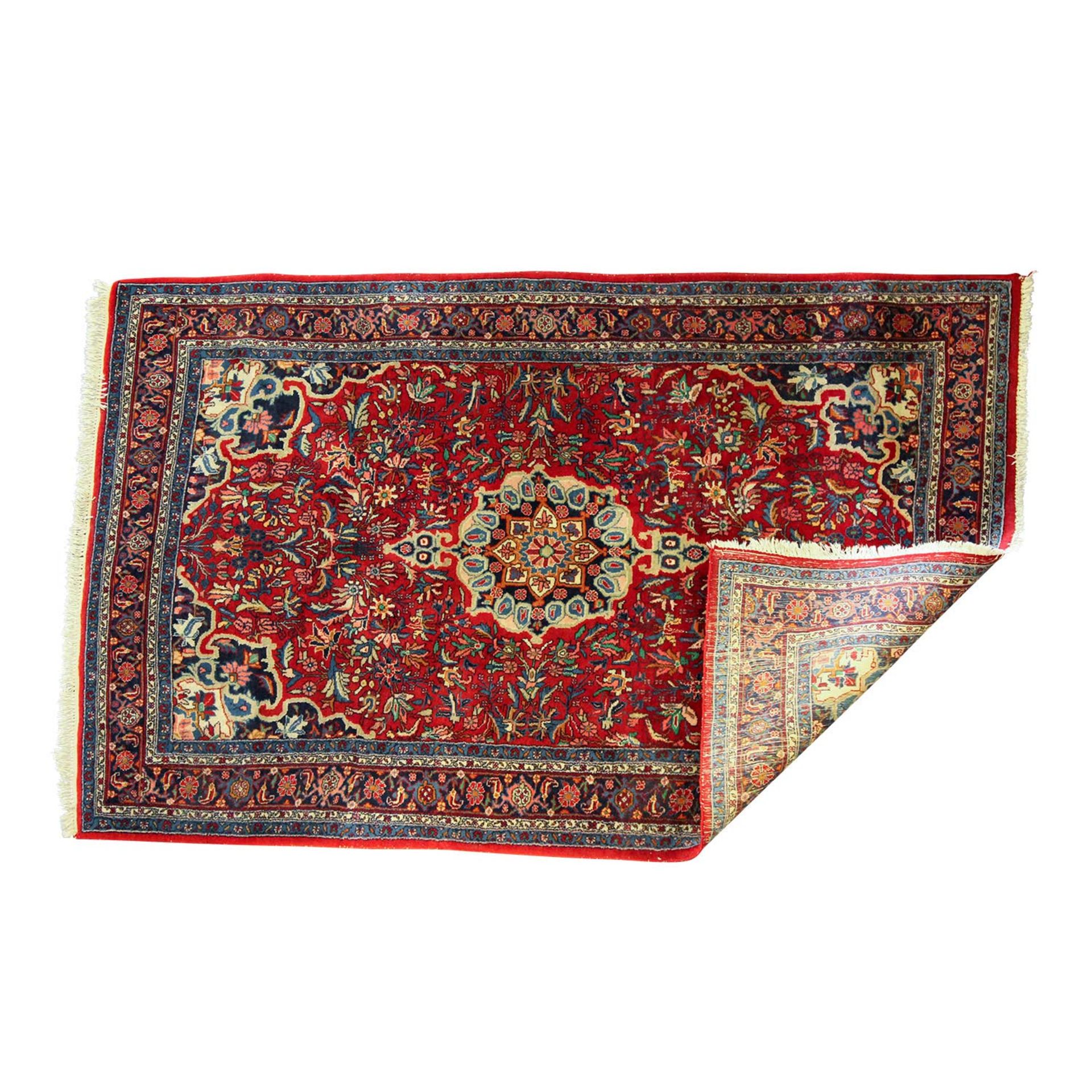 Orientteppich. SANDJAN/IRAN, 20. Jh., ca. 202x130 cm ein sternförmiges Zentralmedaillon mit