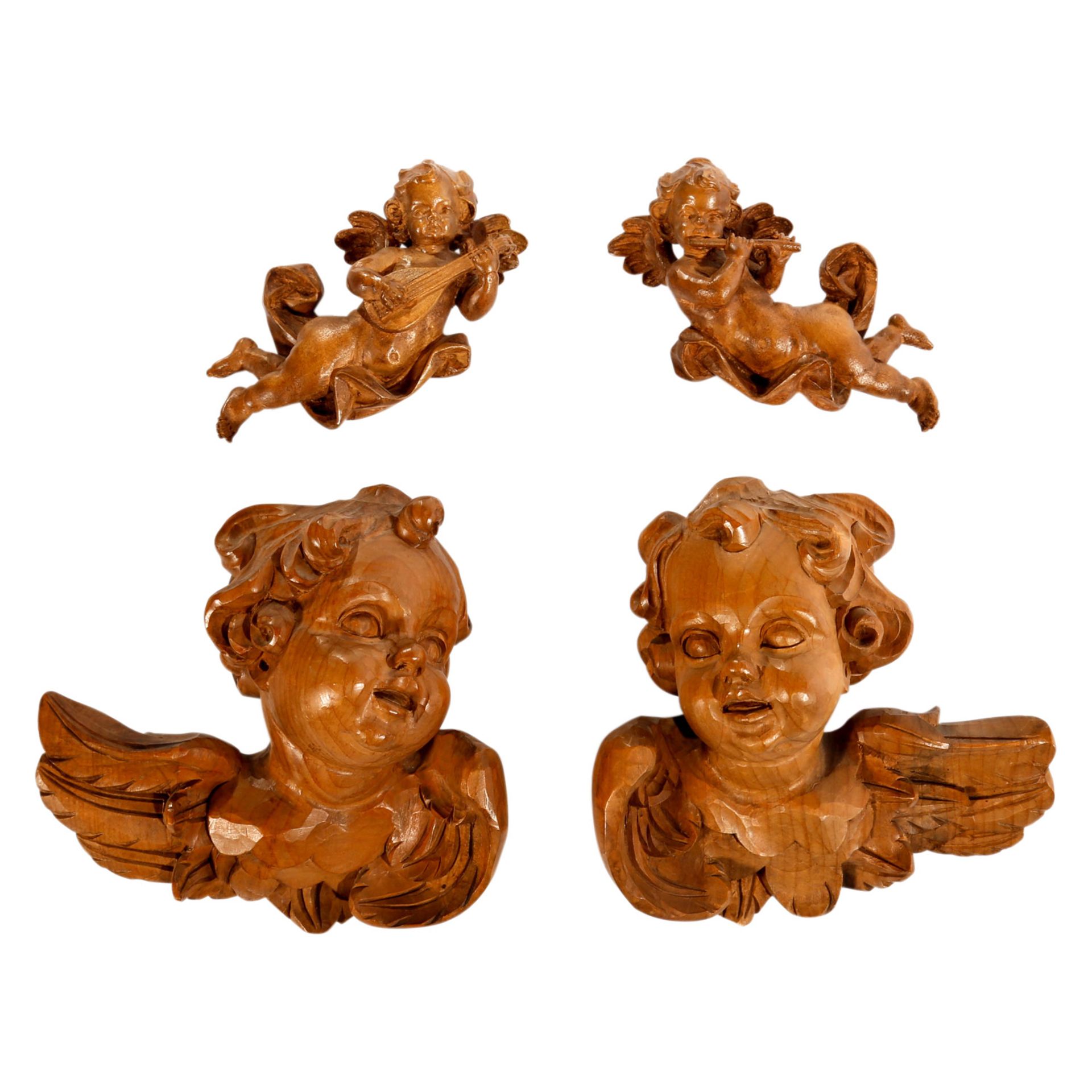 VIER HOLZENGEL 20. Jh., Paar geflügelter Engelsköpfe (H: 18 cm.) und musizierendes Engel-Paar (L: 20