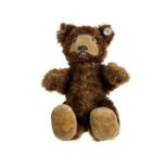 STEIFF Teddy Baby 7309, 1949-1957, Knopf, dunkelbrauner Mohairplüsch, Samtschnauze u. -füße,