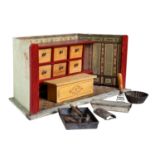 Konvolut, 1.H. 20.Jh., bestehend aus Kaufladen aus Holz, Schubladen part. aus Pappe, Kamin aus