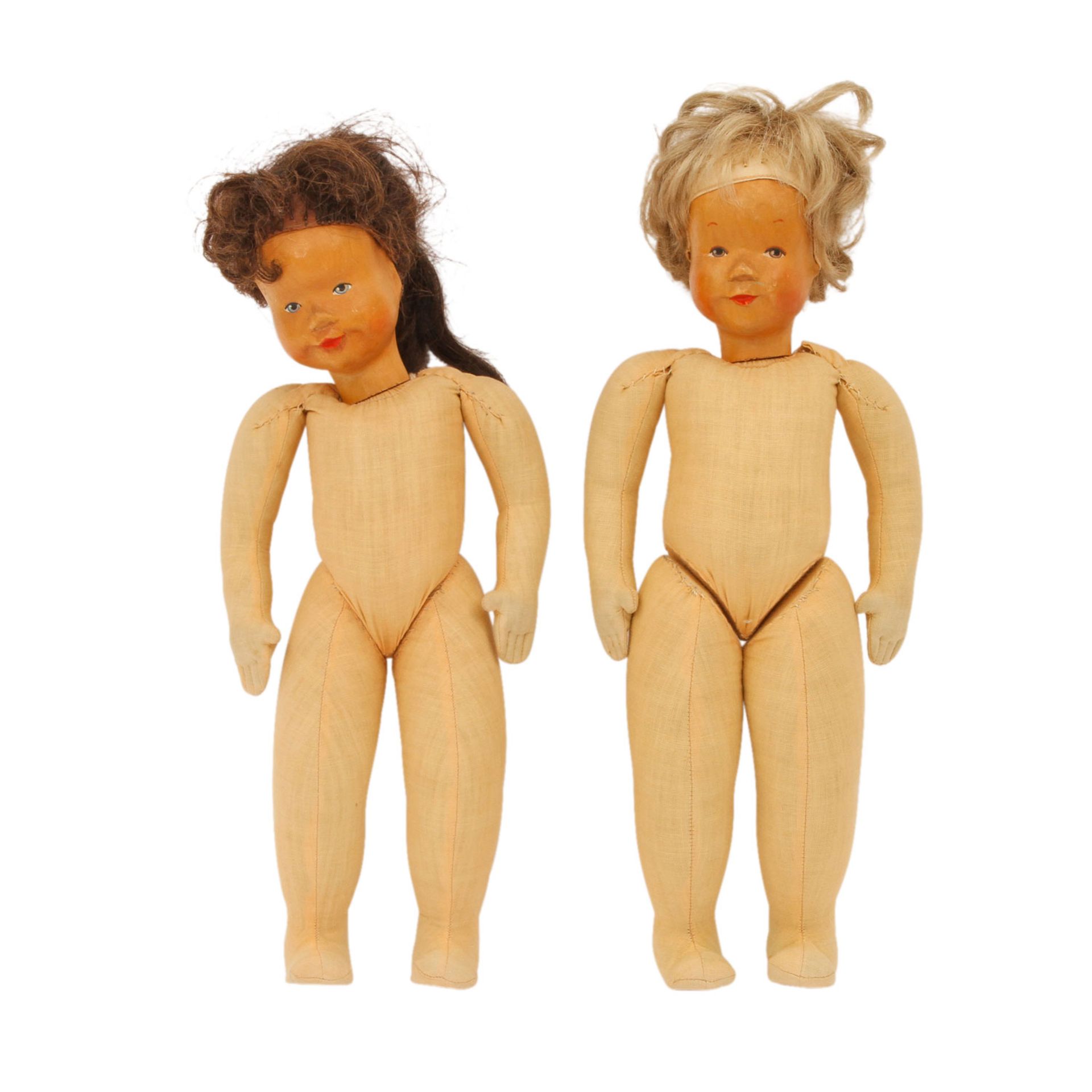 KRAHMER zwei Puppen, Mitte 20.Jh.,Kopf aus Holz geschnitzt u. farbig gefasst, blonde bzw.