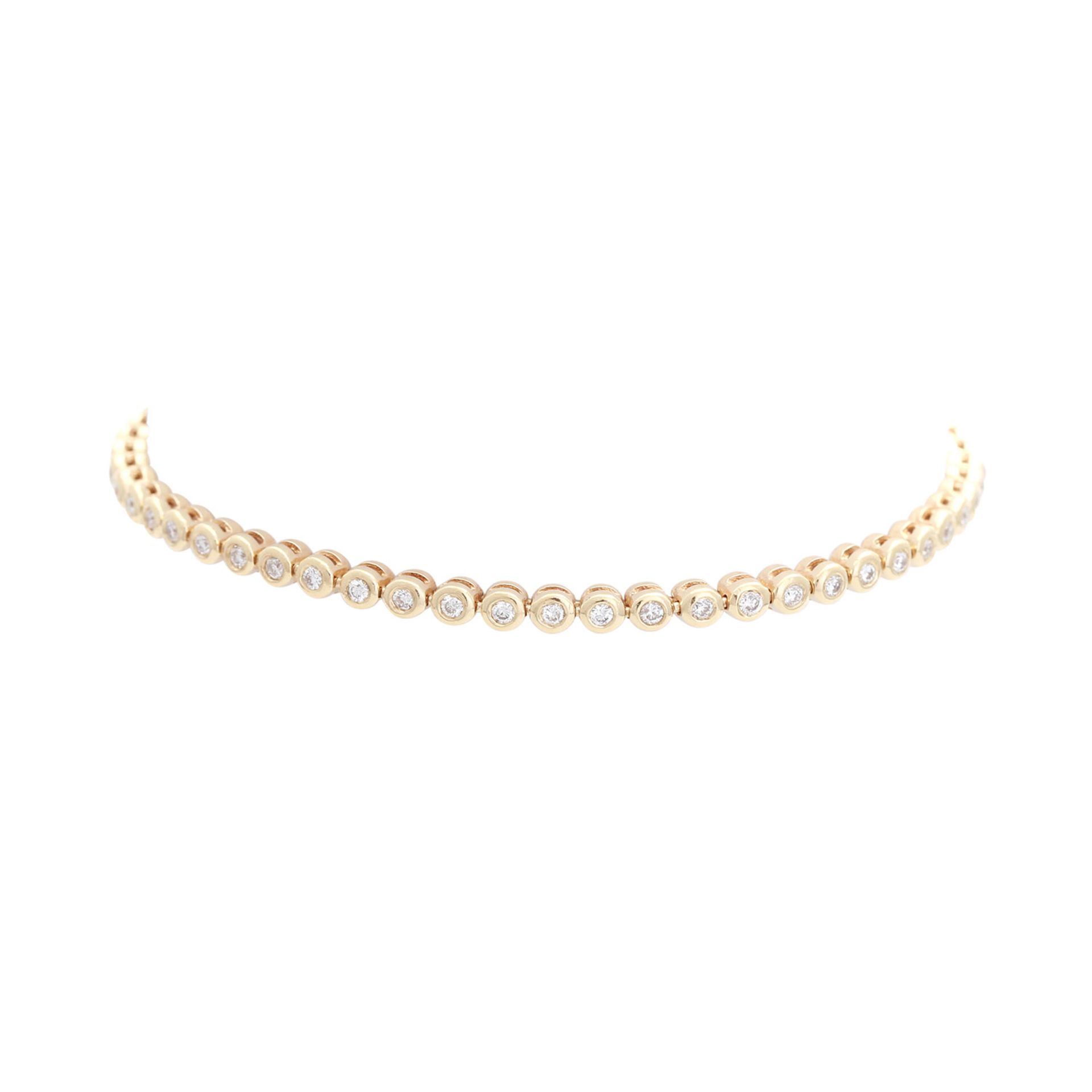 Armband mit Diamantbesatz zus. ca. 1 ct LGW / SI 1 in GG 14K. L: ca. 19 cm. B: ca. 3 mm. Leichte