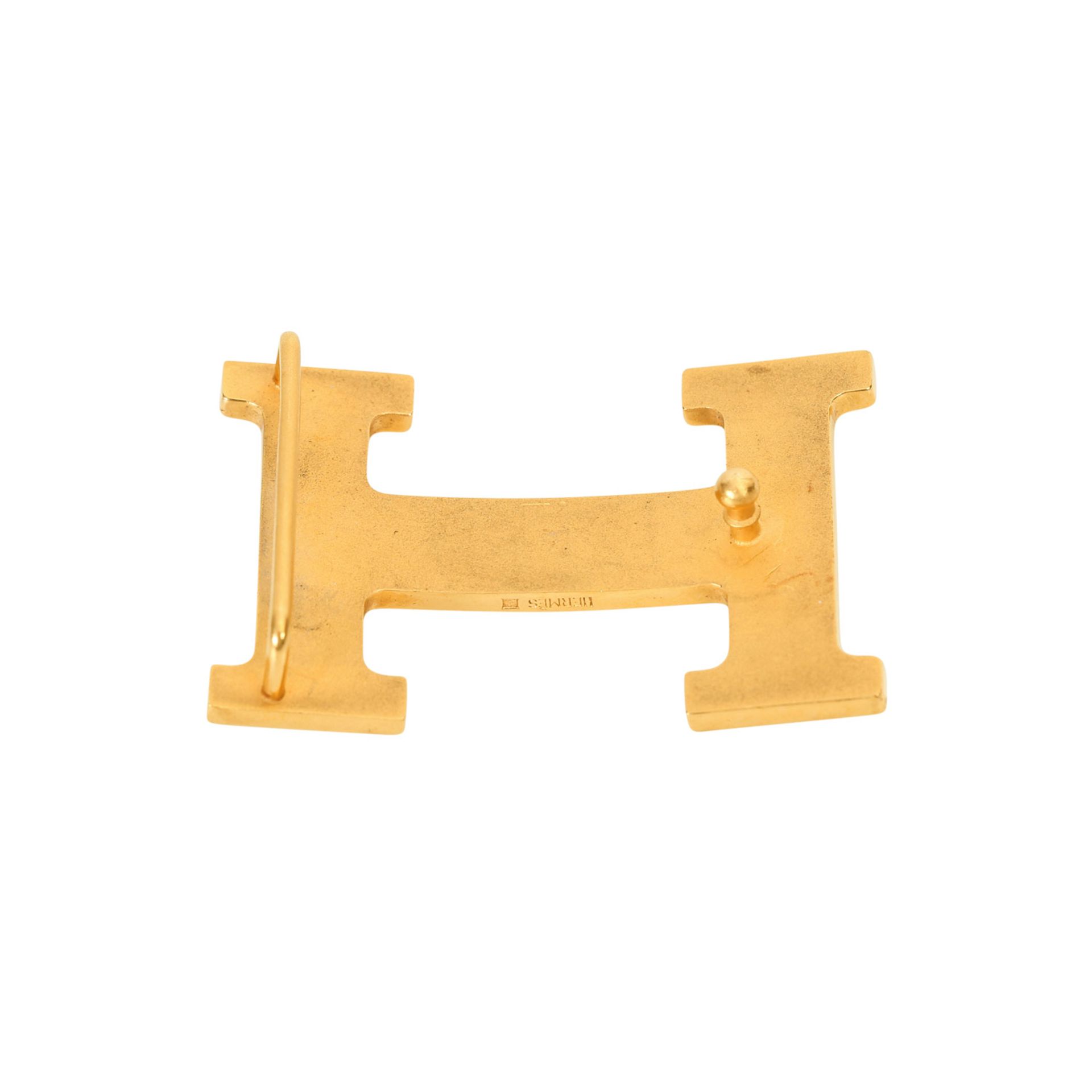 HERMÈS Gürtelschnalle, NP.: ca. 300,-€. Goldfarbene H-Schließe, starke Gebrauchsspuren. L: 6cm B:3, - Bild 3 aus 3