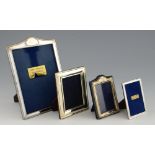 Four various silver hallmarked and sterling, photograph frames, overall sizes 22 x 15 cms, 13 x 10