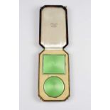 Silver and green enamel compact and cigarette case, hallmarked Birmingham 1933, by Adie Brothers