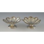 Pair of Edward VII silver bon bon dishes of floral form with pierced decoration on round feet, by