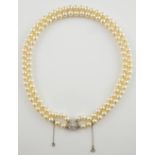 Cultured pearl necklace with diamond clasp, cluster of round brilliant cut diamonds, mounted in