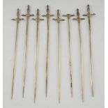 Set of eight Continental silver coloured metal meat skewers in the form of swords, marked '925', 5.